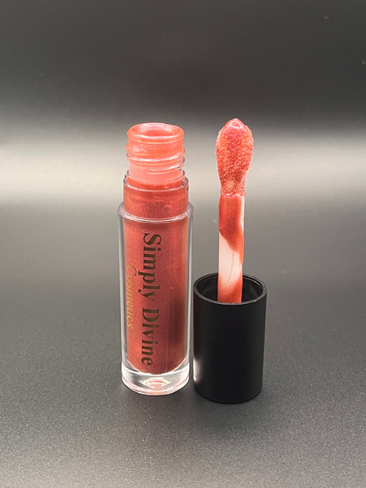 Rebekah pink lip gloss swatch - vegan cruelty-free color-changing formula with nourishing oils"