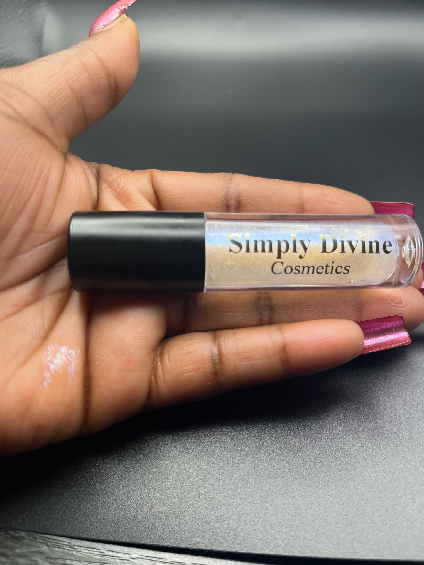 Sarah luxury vegan lip gloss application - premium blue sparkle luminous cruelty-free cosmetics"